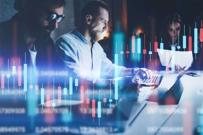 Professionals analyzing real-time access control data on laptops with digital security interface overlays – ScreenCheck, UAE