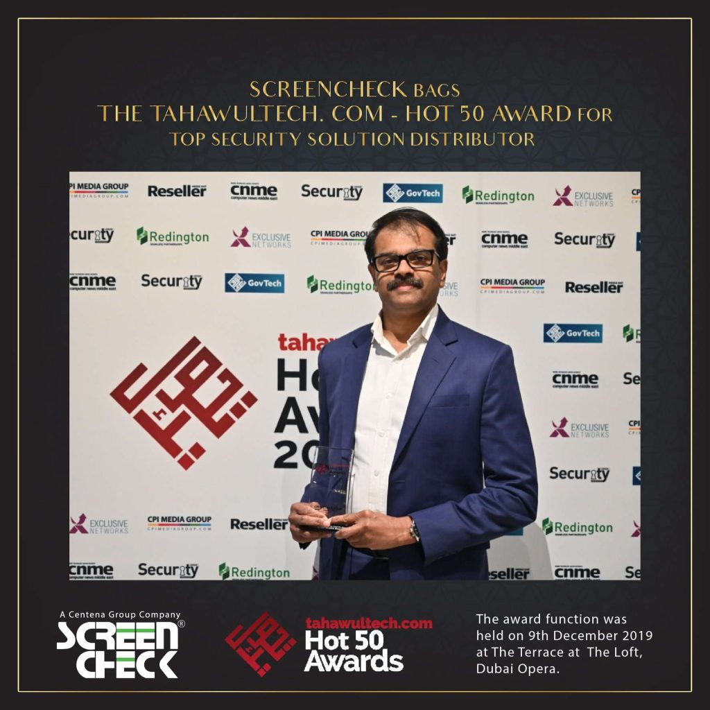 ScreenCheck representative holding Tahawultech Hot 50 Award 2019 for Top Security Solution Distributor in Dubai